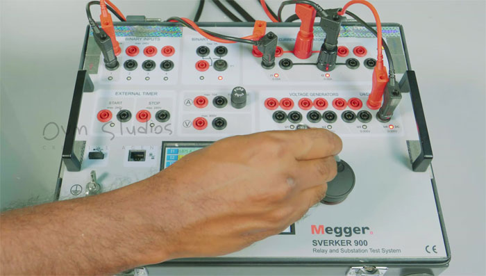 Close-up of the Megger SVERKER 900 relay and substation test system, showcasing its control panel and test leads in the production demo video.