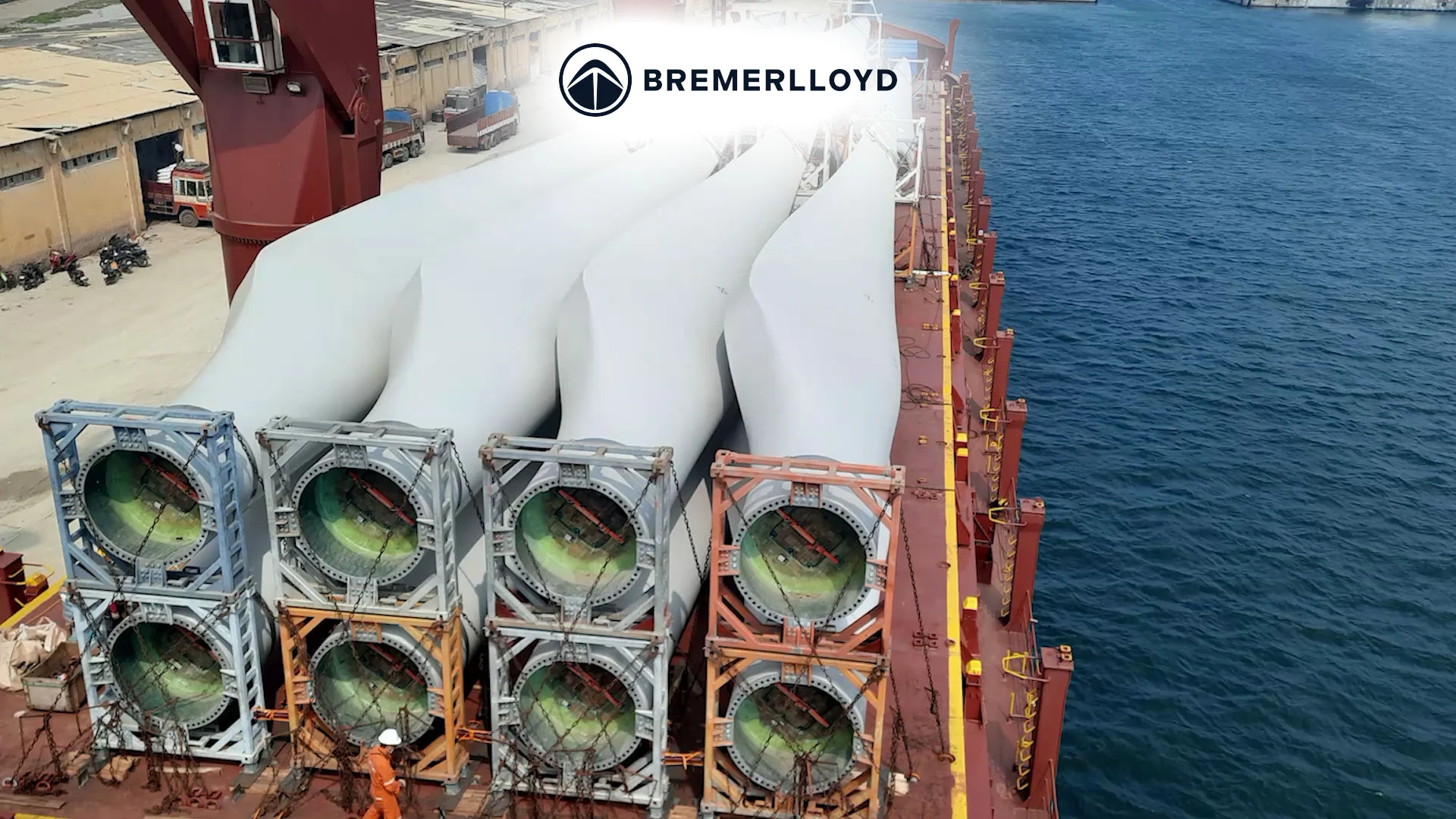 Giant wind turbine blades being loaded onto a cargo ship at a port. The blades are secured and ready for transportation. #ShippingVideo #WindEnergy #RenewableEnergy #Logistics