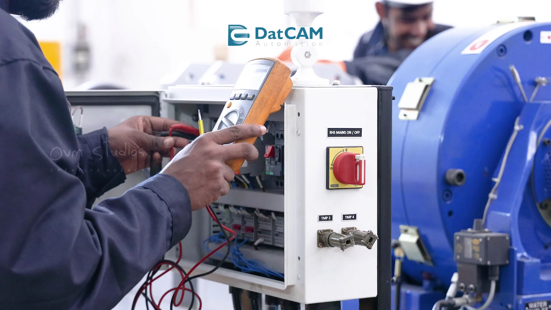 Technician using testing equipment at DatCAM Automation for precise diagnostics